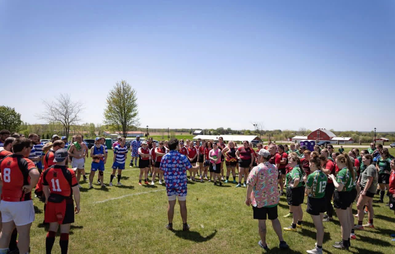 Clubs gathered in a large pre-match circle at a tournament