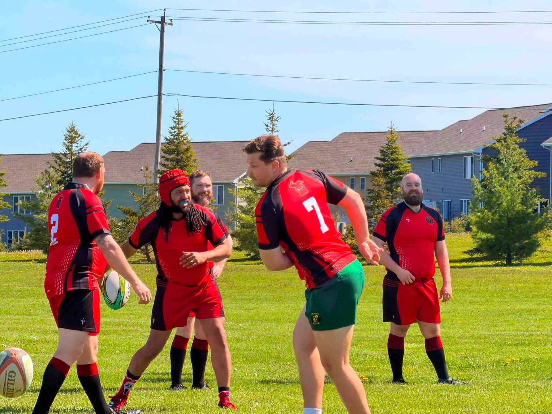 Berserkers players warming up with passing drills in kit