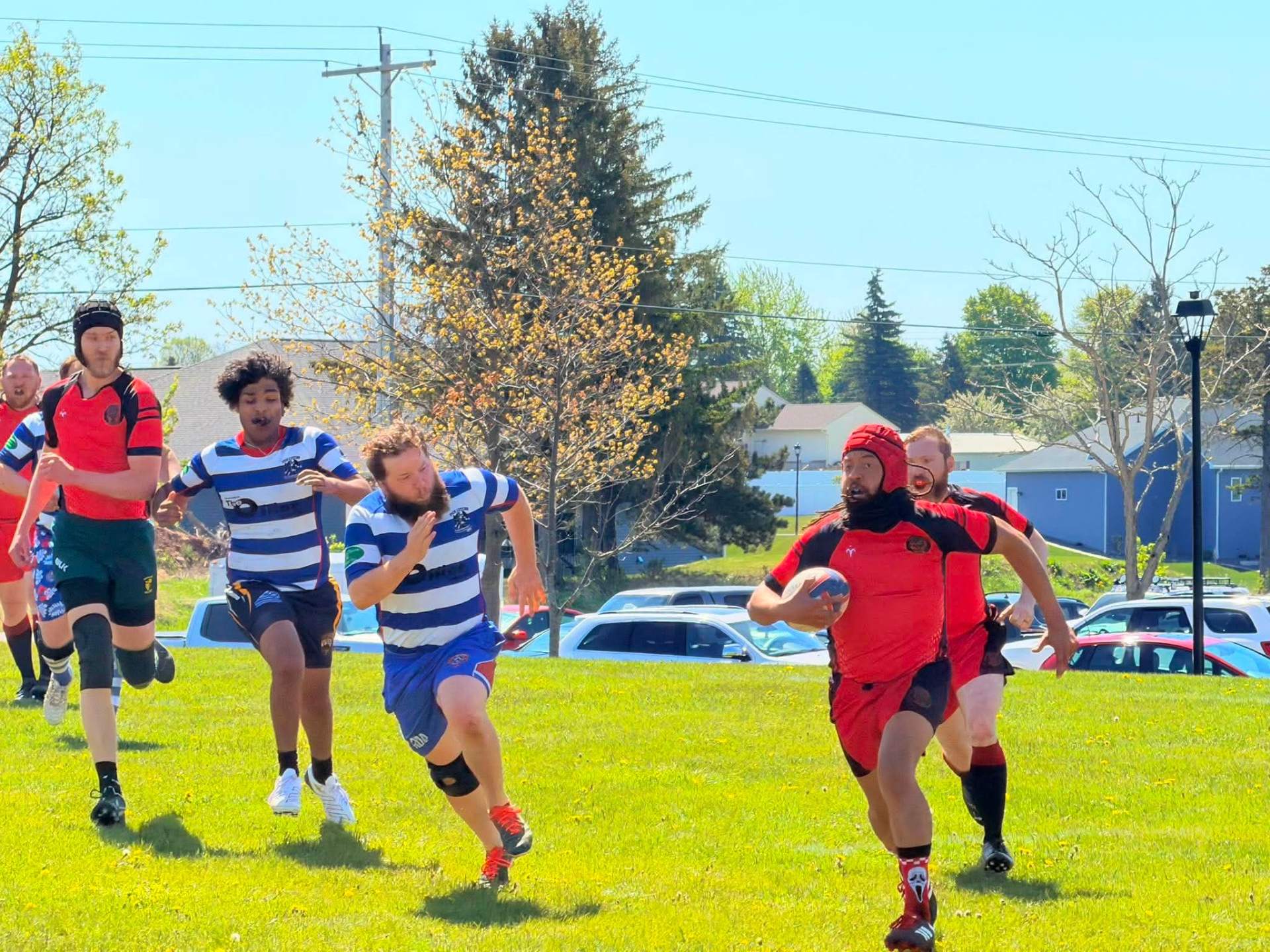 Berserkers player breaking through the defensive line with the ball