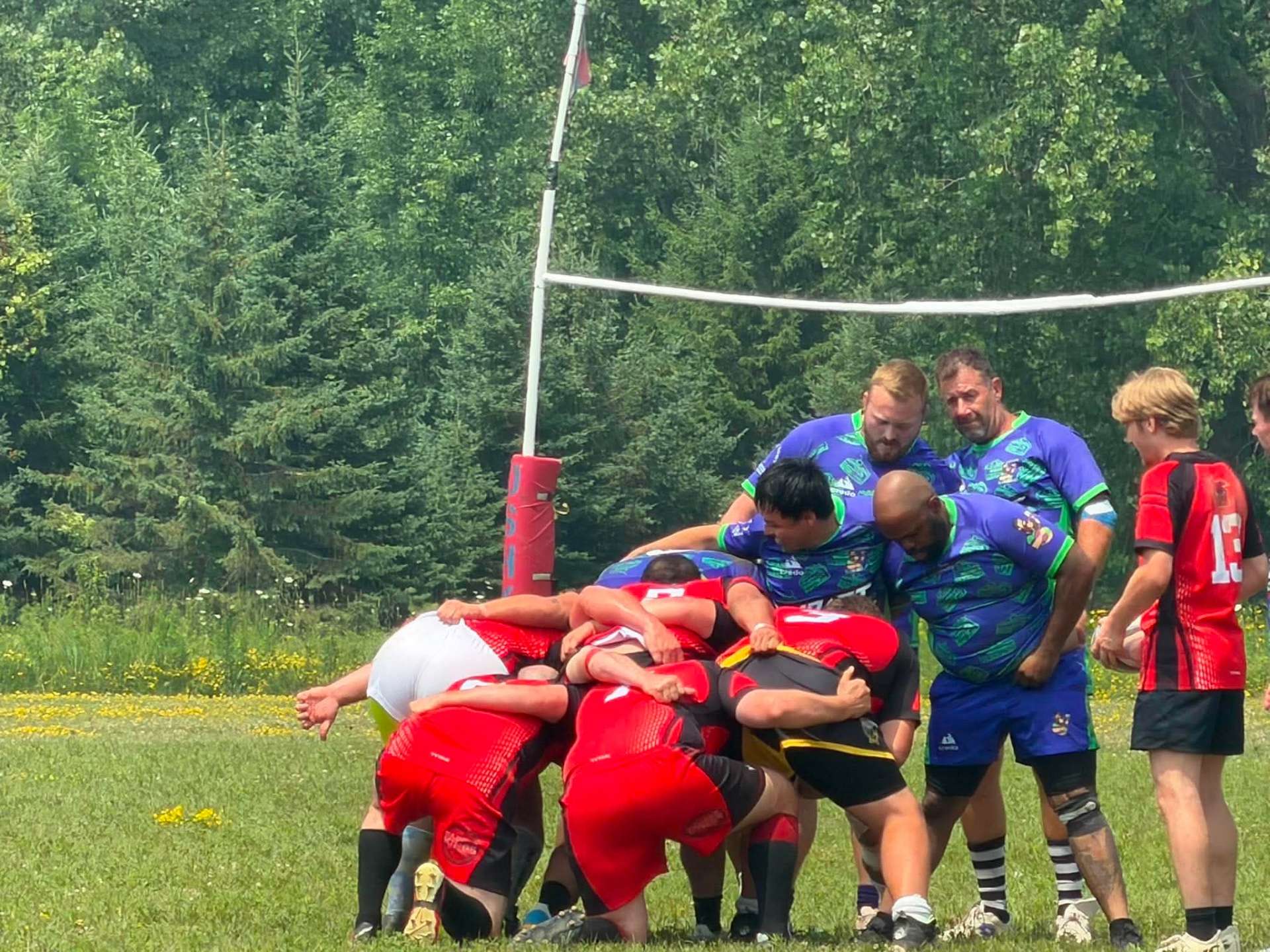 Berserkers driving a maul near the posts against a blue and green side