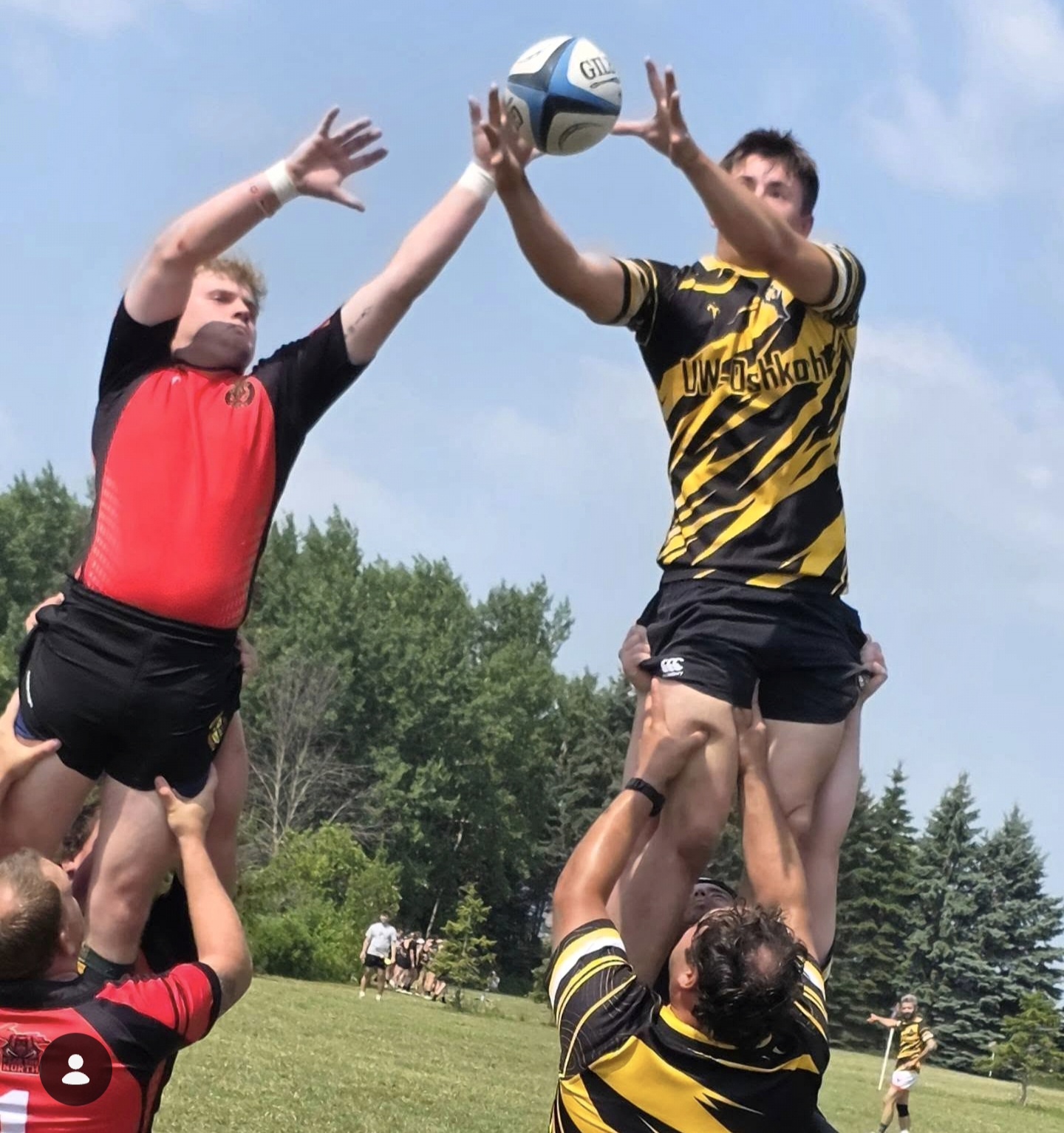 Berserkers jumper lifted at a lineout contesting the ball against a black and gold side