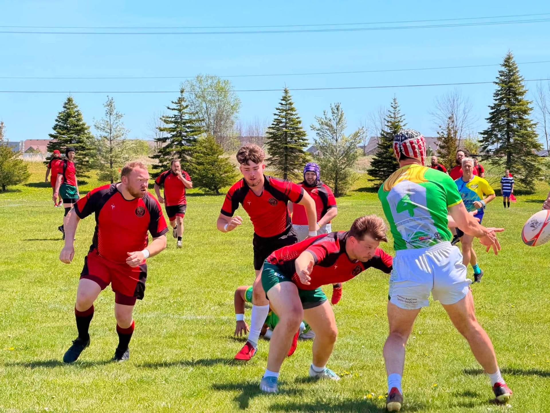 Berserkers players closing in as an opponent releases a pass